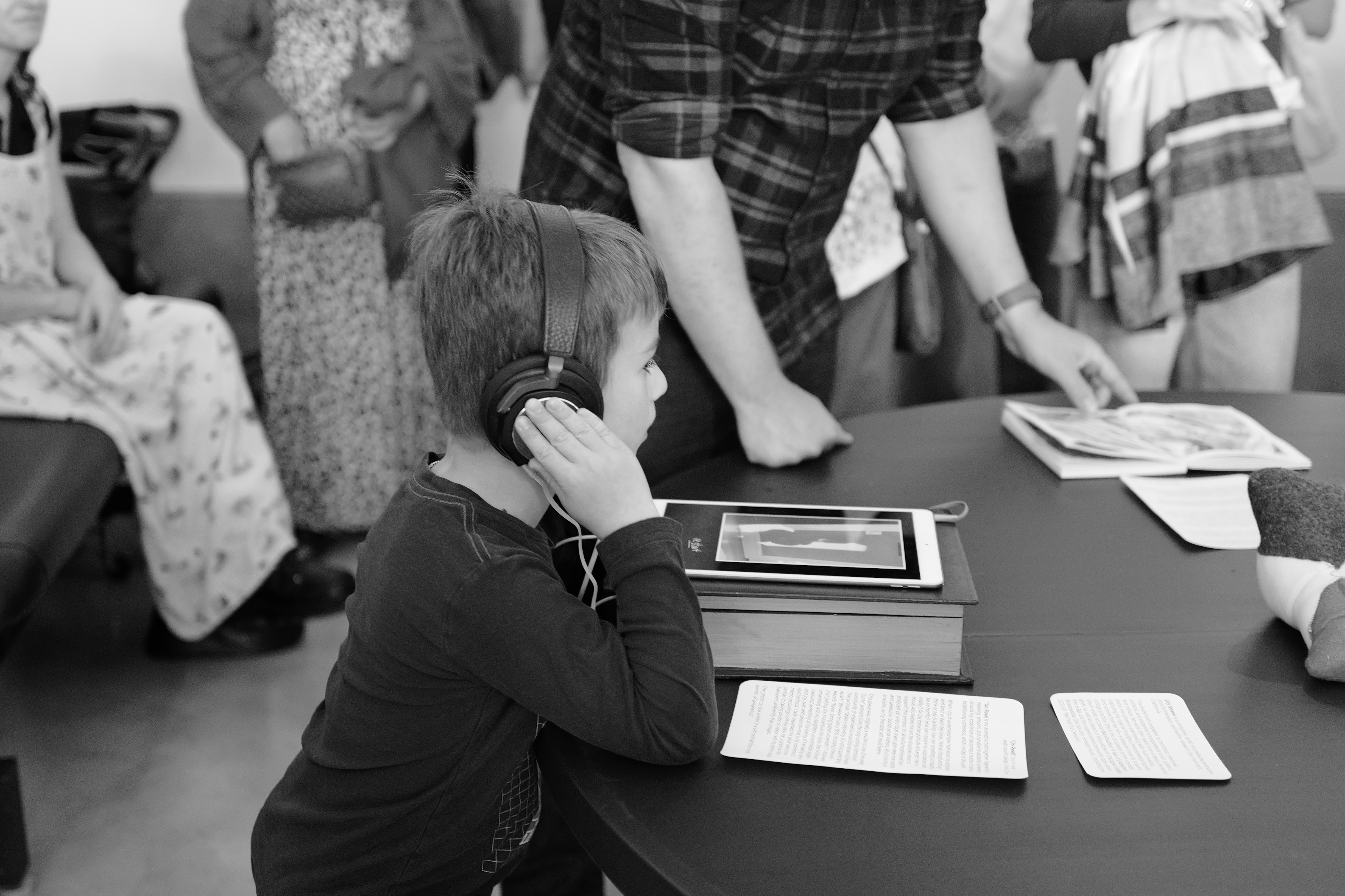 A child listening on headphones at the show.