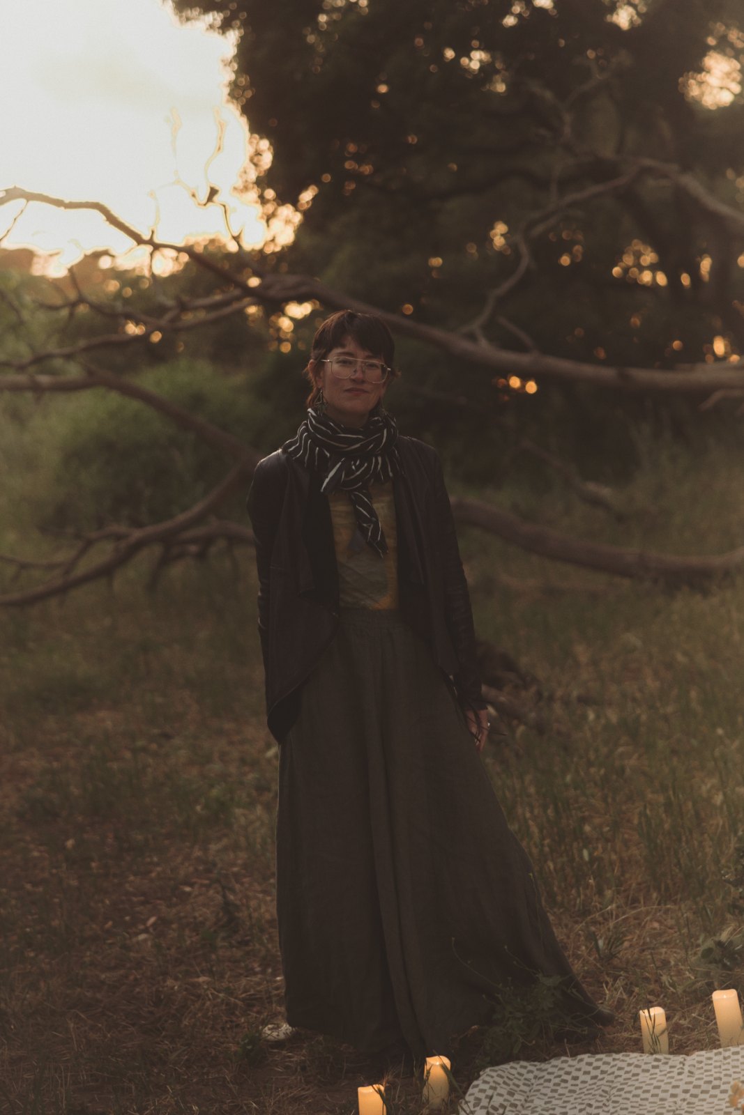 A woman stands beneath the fallen oak